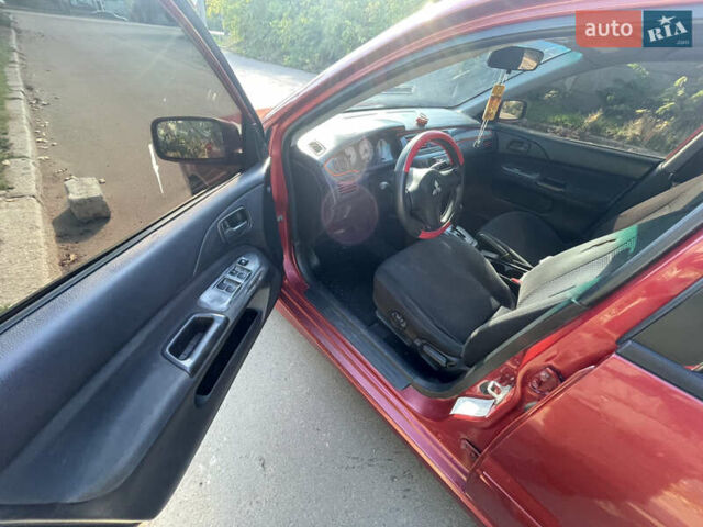 Красный Мицубиси Лансер, объемом двигателя 1.58 л и пробегом 290 тыс. км за 4350 $, фото 17 на Automoto.ua
