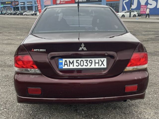 Красный Мицубиси Лансер, объемом двигателя 2 л и пробегом 295 тыс. км за 4150 $, фото 5 на Automoto.ua
