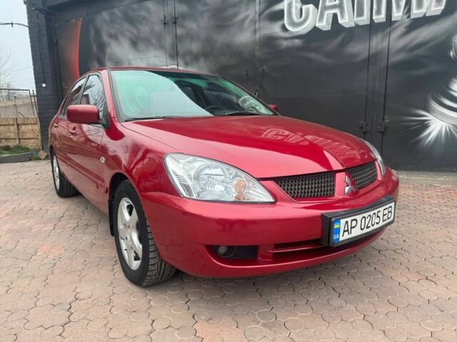 Красный Мицубиси Лансер, объемом двигателя 1.6 л и пробегом 276 тыс. км за 4350 $, фото 2 на Automoto.ua