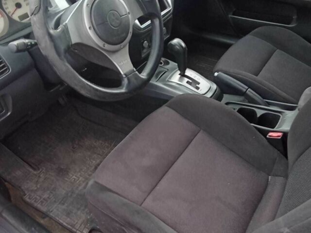 Красный Мицубиси Лансер, объемом двигателя 2 л и пробегом 320 тыс. км за 4600 $, фото 7 на Automoto.ua