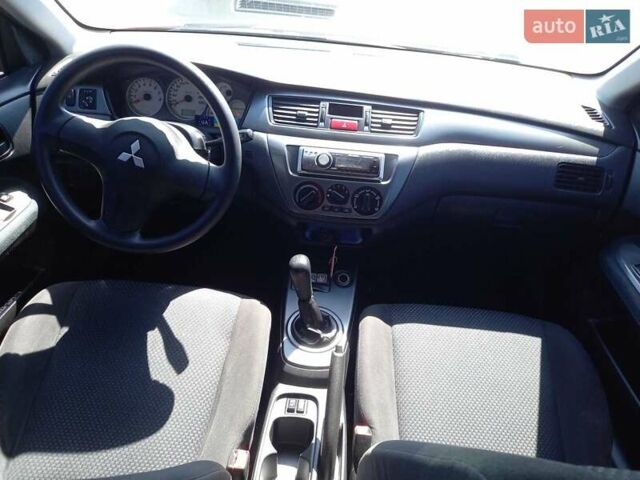 Червоний Міцубісі Lancer, об'ємом двигуна 1.6 л та пробігом 156 тис. км за 5200 $, фото 16 на Automoto.ua
