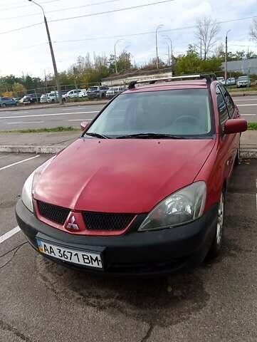Красный Мицубиси Лансер, объемом двигателя 2 л и пробегом 320 тыс. км за 4600 $, фото 2 на Automoto.ua