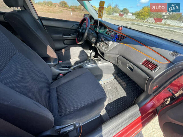 Красный Мицубиси Лансер, объемом двигателя 1.58 л и пробегом 290 тыс. км за 4350 $, фото 10 на Automoto.ua