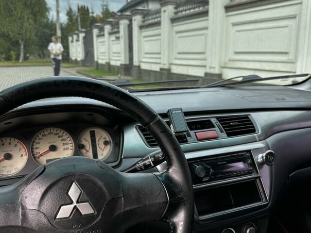Червоний Міцубісі Lancer, об'ємом двигуна 1.6 л та пробігом 270 тис. км за 2200 $, фото 6 на Automoto.ua