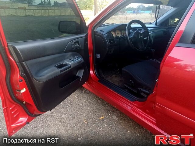 Мицубиси Лансер 2006 в Николаеве на Automoto.ua Красный Мицубиси Лансер, объемом двигателя 1.6 л и пробегом 260 тыс. км за 4600 $, фото 7 на Automoto.ua