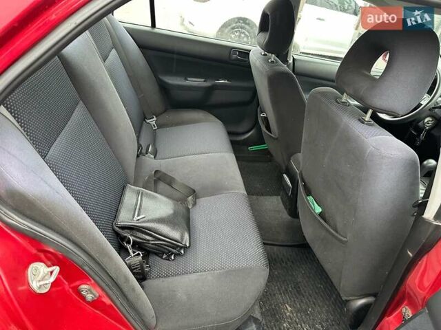 Красный Мицубиси Лансер, объемом двигателя 1.6 л и пробегом 185 тыс. км за 5000 $, фото 9 на Automoto.ua