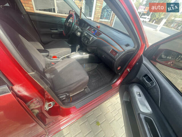 Червоний Міцубісі Lancer, об'ємом двигуна 1.58 л та пробігом 290 тис. км за 4250 $, фото 14 на Automoto.ua