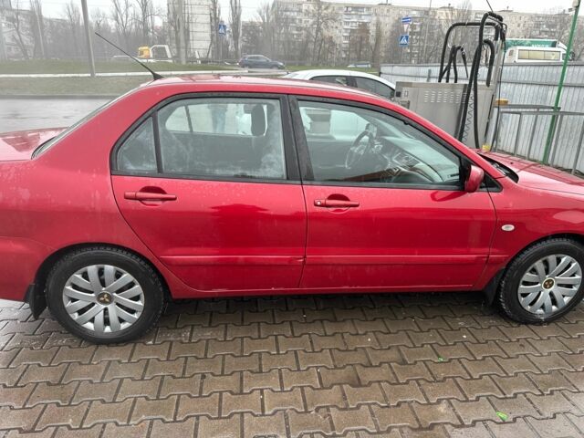 Червоний Міцубісі Lancer, об'ємом двигуна 1.6 л та пробігом 185 тис. км за 5000 $, фото 6 на Automoto.ua