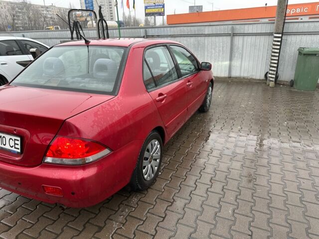 Червоний Міцубісі Lancer, об'ємом двигуна 1.6 л та пробігом 185 тис. км за 5000 $, фото 5 на Automoto.ua