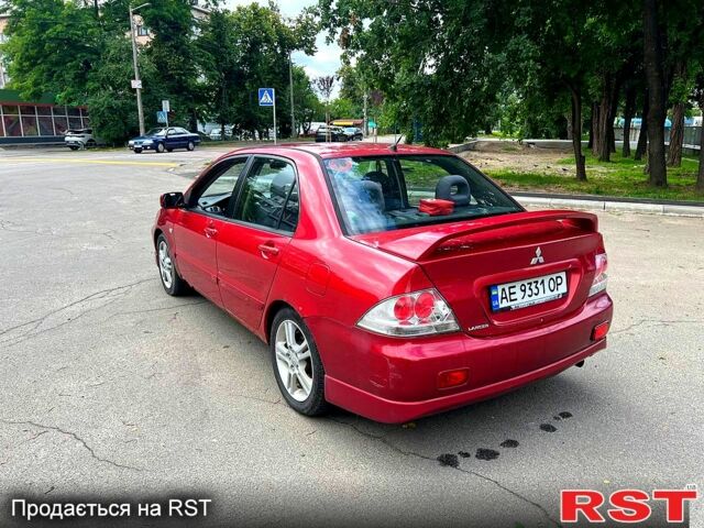 Красный Мицубиси Лансер, объемом двигателя 2 л и пробегом 223 тыс. км за 2900 $, фото 3 на Automoto.ua