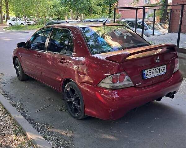 Червоний Міцубісі Lancer, об'ємом двигуна 1.6 л та пробігом 250 тис. км за 3199 $, фото 1 на Automoto.ua