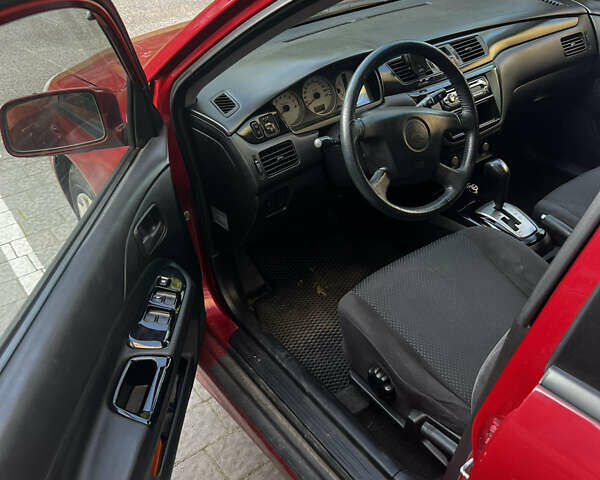 Красный Мицубиси Лансер, объемом двигателя 1.6 л и пробегом 312 тыс. км за 4600 $, фото 7 на Automoto.ua