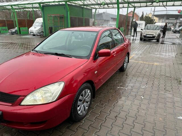 Червоний Міцубісі Lancer, об'ємом двигуна 1.6 л та пробігом 185 тис. км за 5000 $, фото 1 на Automoto.ua