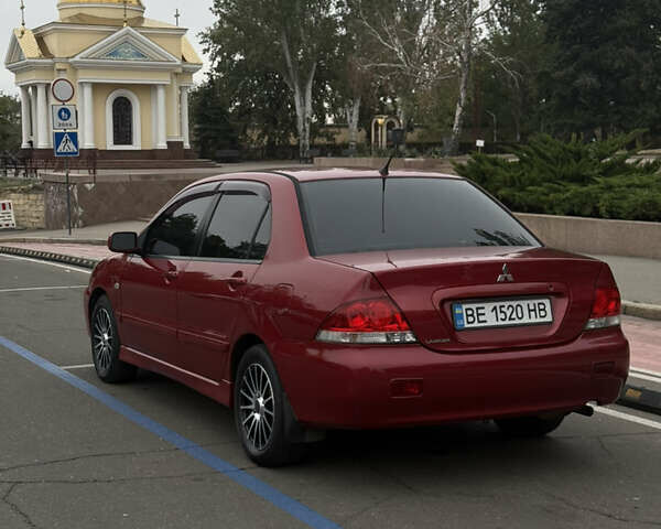 Красный Мицубиси Лансер, объемом двигателя 1.6 л и пробегом 268 тыс. км за 4200 $, фото 3 на Automoto.ua