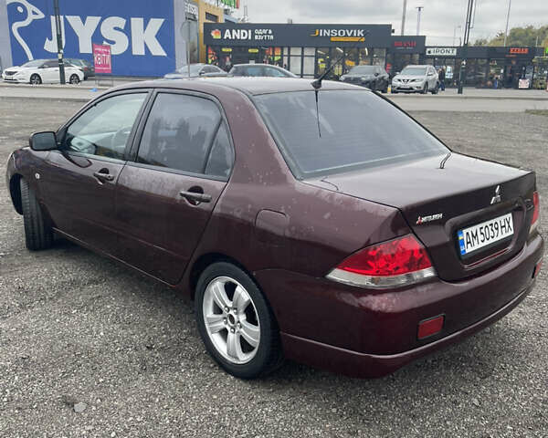 Червоний Міцубісі Lancer, об'ємом двигуна 2 л та пробігом 295 тис. км за 4150 $, фото 6 на Automoto.ua