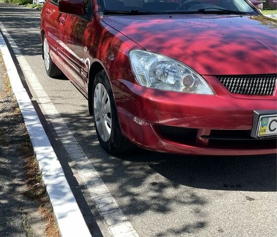 Червоний Міцубісі Lancer, об'ємом двигуна 0.16 л та пробігом 168 тис. км за 5100 $, фото 1 на Automoto.ua