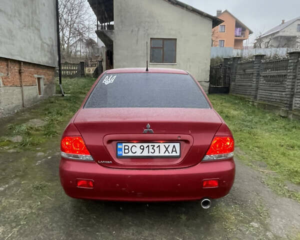 Червоний Міцубісі Lancer, об'ємом двигуна 1.58 л та пробігом 237 тис. км за 4700 $, фото 1 на Automoto.ua