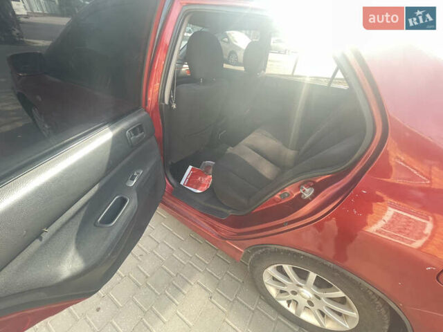 Червоний Міцубісі Lancer, об'ємом двигуна 1.58 л та пробігом 290 тис. км за 4250 $, фото 12 на Automoto.ua