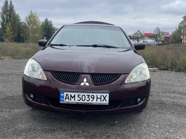 Красный Мицубиси Лансер, объемом двигателя 2 л и пробегом 295 тыс. км за 4150 $, фото 2 на Automoto.ua