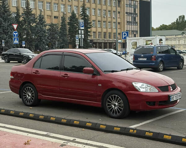 Красный Мицубиси Лансер, объемом двигателя 1.6 л и пробегом 268 тыс. км за 4200 $, фото 1 на Automoto.ua