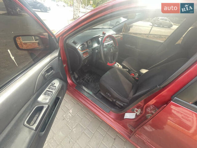 Червоний Міцубісі Lancer, об'ємом двигуна 1.58 л та пробігом 290 тис. км за 4250 $, фото 10 на Automoto.ua