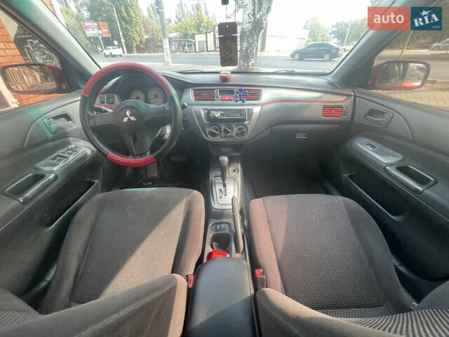 Червоний Міцубісі Lancer, об'ємом двигуна 1.58 л та пробігом 290 тис. км за 4250 $, фото 15 на Automoto.ua
