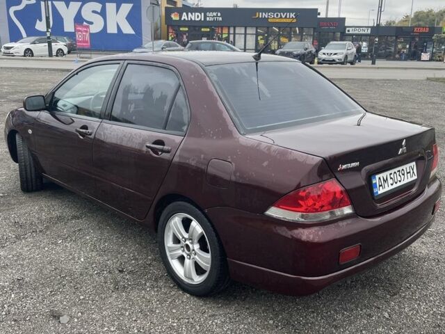 Красный Мицубиси Лансер, объемом двигателя 2 л и пробегом 295 тыс. км за 4150 $, фото 6 на Automoto.ua