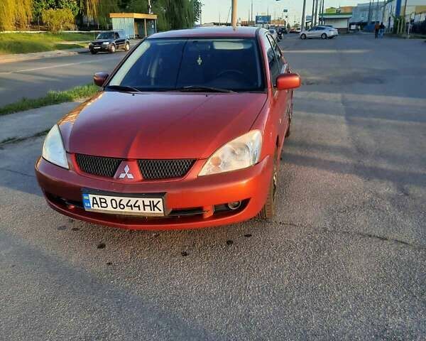 Красный Мицубиси Лансер, объемом двигателя 1.58 л и пробегом 180 тыс. км за 4000 $, фото 6 на Automoto.ua
