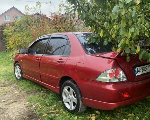 Міцубісі Lancer 2006 у Вышгороде на Automoto.ua Червоний Міцубісі Lancer, об'ємом двигуна 2 л та пробігом 320 тис. км за 2500 $, фото 4 на Automoto.ua