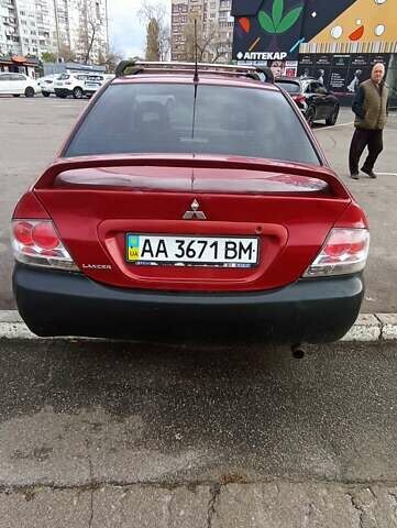 Красный Мицубиси Лансер, объемом двигателя 2 л и пробегом 320 тыс. км за 4600 $, фото 7 на Automoto.ua