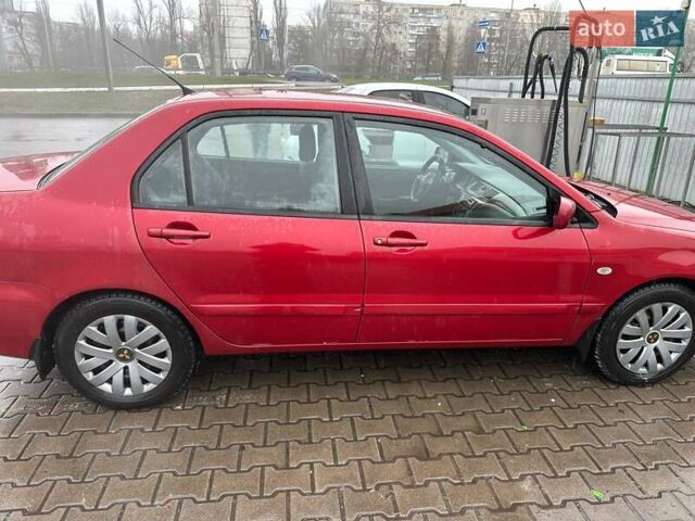 Красный Мицубиси Лансер, объемом двигателя 1.6 л и пробегом 185 тыс. км за 5000 $, фото 5 на Automoto.ua