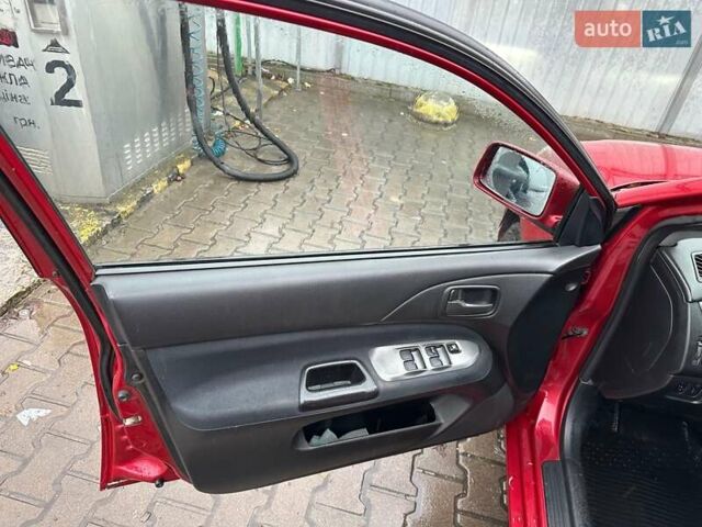 Красный Мицубиси Лансер, объемом двигателя 1.6 л и пробегом 185 тыс. км за 5000 $, фото 12 на Automoto.ua