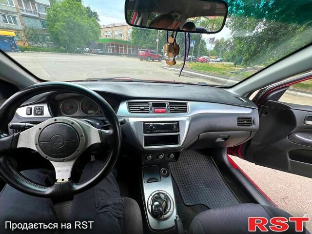 Красный Мицубиси Лансер, объемом двигателя 2 л и пробегом 223 тыс. км за 2900 $, фото 5 на Automoto.ua