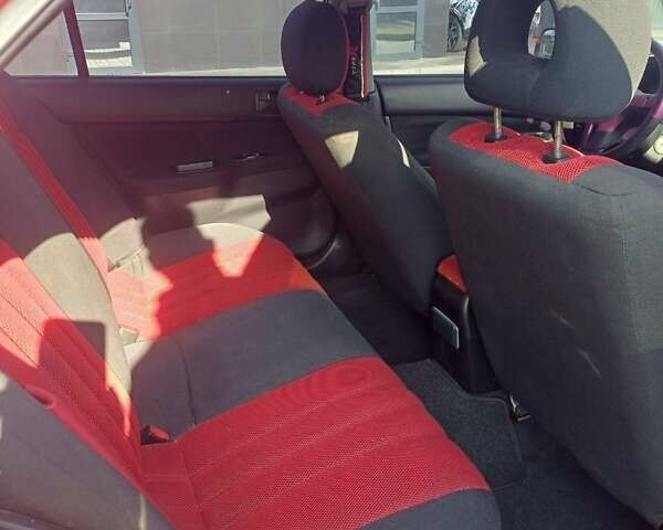 Красный Мицубиси Лансер, объемом двигателя 1.6 л и пробегом 73 тыс. км за 5500 $, фото 6 на Automoto.ua