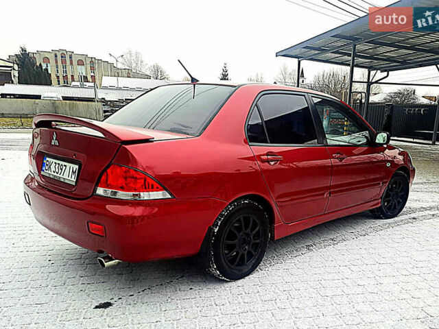 Червоний Міцубісі Lancer, об'ємом двигуна 1.58 л та пробігом 211 тис. км за 3600 $, фото 4 на Automoto.ua