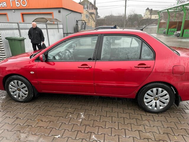 Червоний Міцубісі Lancer, об'ємом двигуна 1.6 л та пробігом 185 тис. км за 5000 $, фото 2 на Automoto.ua