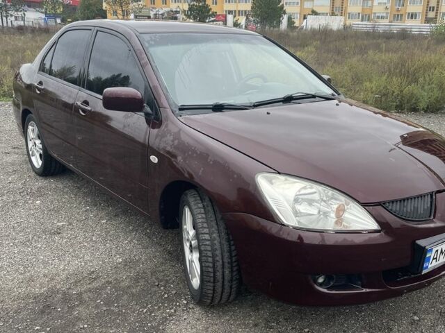 Красный Мицубиси Лансер, объемом двигателя 2 л и пробегом 295 тыс. км за 4150 $, фото 3 на Automoto.ua