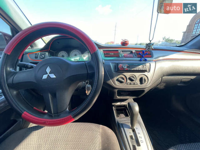 Червоний Міцубісі Lancer, об'ємом двигуна 1.58 л та пробігом 290 тис. км за 4350 $, фото 11 на Automoto.ua