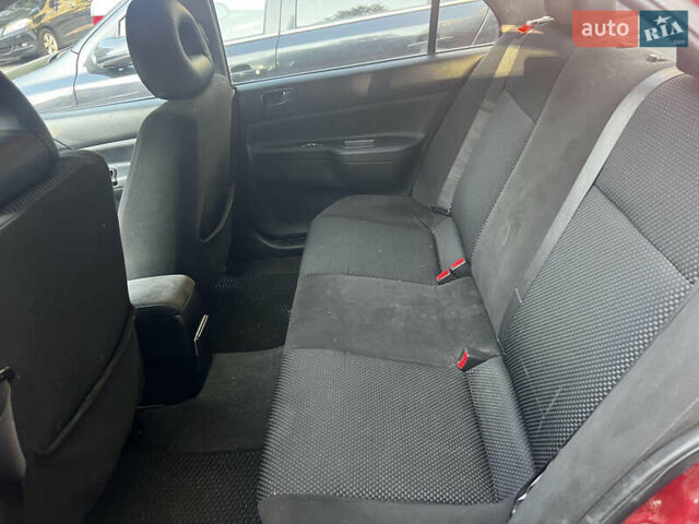 Красный Мицубиси Лансер, объемом двигателя 1.6 л и пробегом 312 тыс. км за 4600 $, фото 5 на Automoto.ua