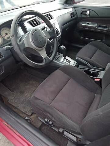 Красный Мицубиси Лансер, объемом двигателя 2 л и пробегом 320 тыс. км за 4600 $, фото 6 на Automoto.ua