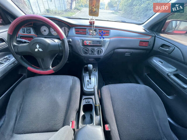 Красный Мицубиси Лансер, объемом двигателя 1.58 л и пробегом 290 тыс. км за 4350 $, фото 13 на Automoto.ua