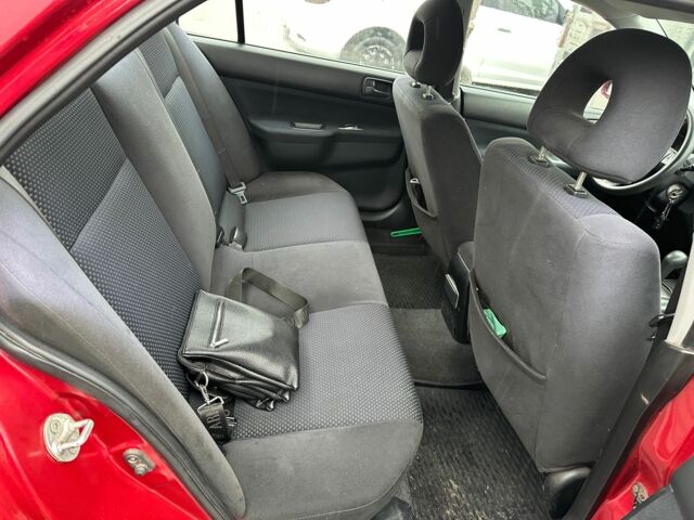Червоний Міцубісі Lancer, об'ємом двигуна 1.6 л та пробігом 185 тис. км за 5000 $, фото 10 на Automoto.ua