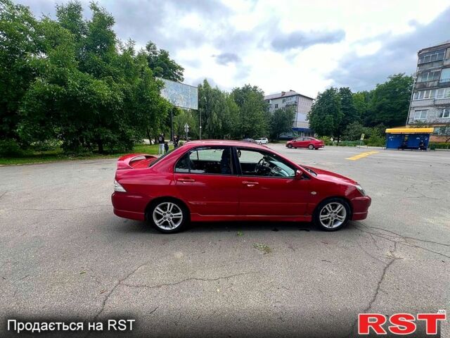 Красный Мицубиси Лансер, объемом двигателя 2 л и пробегом 223 тыс. км за 2900 $, фото 12 на Automoto.ua