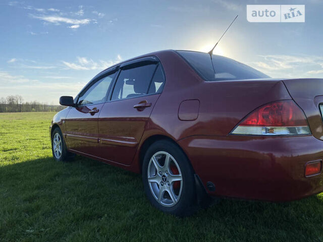 Червоний Міцубісі Lancer, об'ємом двигуна 1.6 л та пробігом 130 тис. км за 5800 $, фото 7 на Automoto.ua