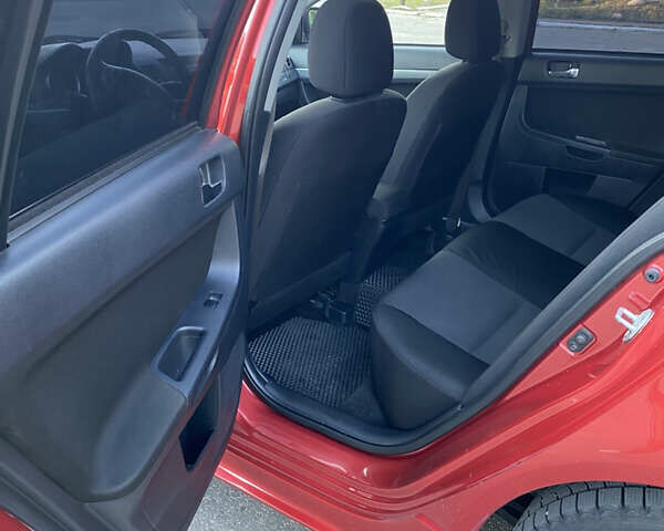 Червоний Міцубісі Lancer, об'ємом двигуна 2 л та пробігом 153 тис. км за 6700 $, фото 9 на Automoto.ua
