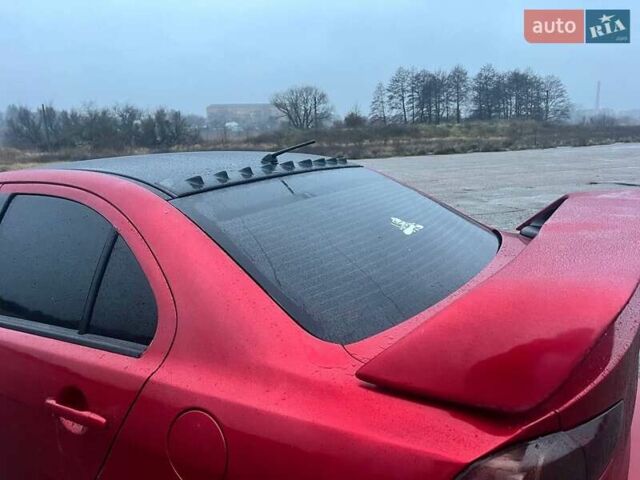 Красный Мицубиси Лансер, объемом двигателя 1.5 л и пробегом 241 тыс. км за 5850 $, фото 15 на Automoto.ua