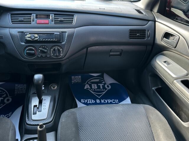 Красный Мицубиси Лансер, объемом двигателя 1.6 л и пробегом 230 тыс. км за 5300 $, фото 7 на Automoto.ua