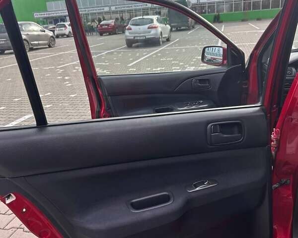 Красный Мицубиси Лансер, объемом двигателя 1.6 л и пробегом 176 тыс. км за 4300 $, фото 18 на Automoto.ua