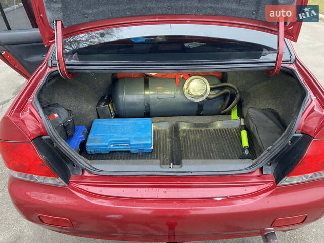 Червоний Міцубісі Lancer, об'ємом двигуна 1.58 л та пробігом 151 тис. км за 5600 $, фото 15 на Automoto.ua