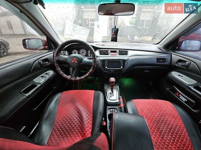 Червоний Міцубісі Lancer, об'ємом двигуна 1.6 л та пробігом 267 тис. км за 2999 $, фото 12 на Automoto.ua